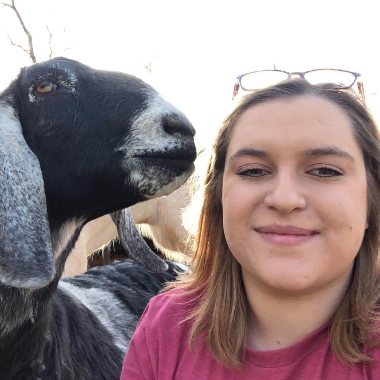 Dakota, our new VP, with her goat